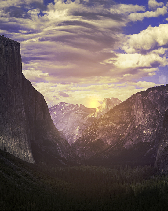 Photo color enhancement service of a sunset between cliffs over a forest valley with a dramatic, cloud-filled sky.
