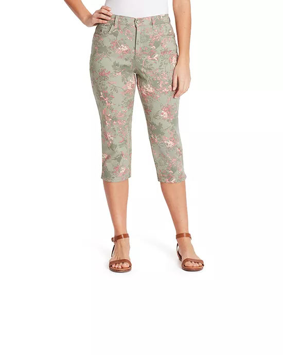 Woman in floral capri pants and white top smiling, used for Image Resizing Services.