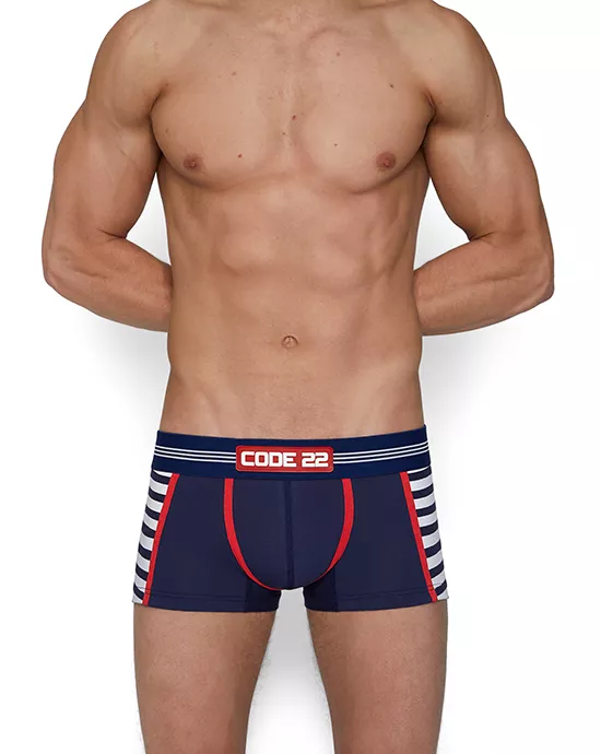 Muscular man from behind in blue and red striped boxer briefs – Ecommerce photo editing services.