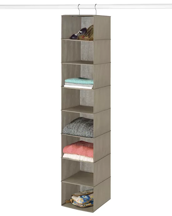 Vertical hanging fabric closet organizer with six compartments containing shoes, towels, and clothes.