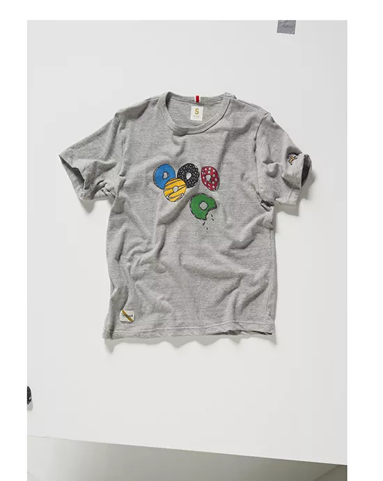 4_Befre Gray t-shirt with colorful donut illustrations displayed on a clean white surface.