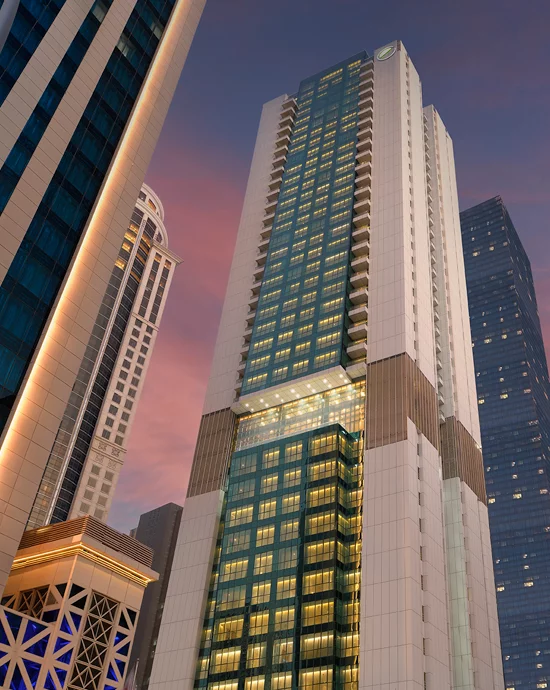 Modern skyscrapers against twilight sky in urban business district – Professional photo retouching services.