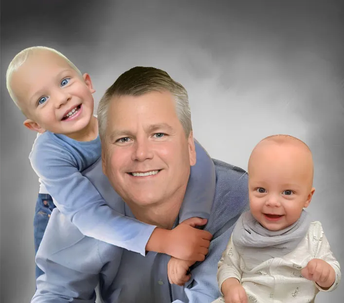 Photo resizing services for a man smiling with a toddler on his back and a baby in front, all looking cheerful.