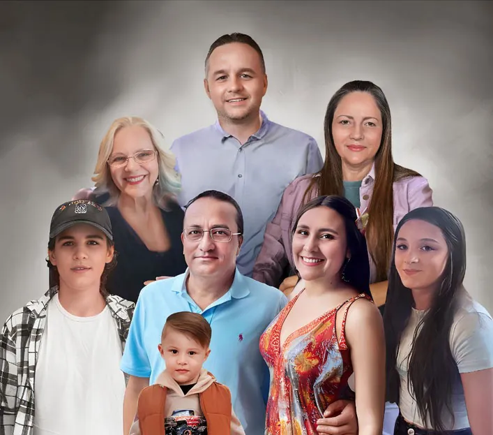 Photo resizing services for a multigenerational family portrait of nine members, smiling against a gray background.