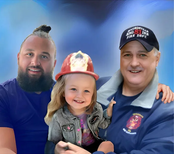 Two men and a young girl smiling, with the girl wearing a firefighter helmet and the older man in a fire department cap.